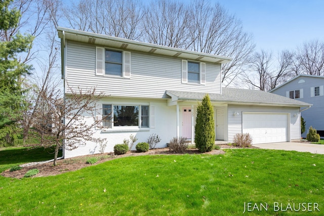 view of front of home featuring a garage, a front lawn, and concrete driveway