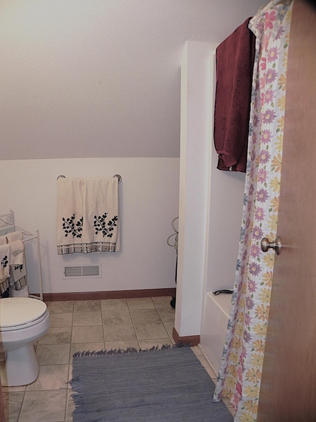 full bathroom with baseboards, toilet, and visible vents