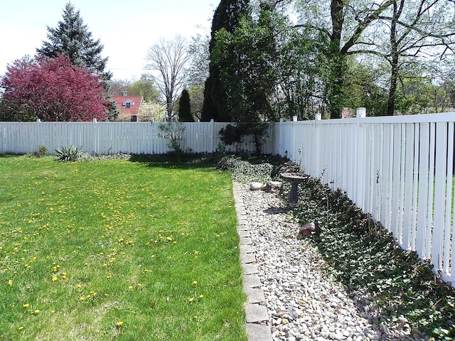 view of yard with a fenced backyard