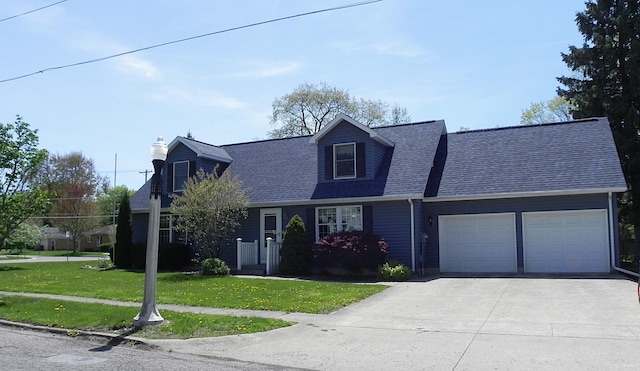 cape cod home with a chimney, a front yard, concrete driveway, an attached garage, and a shingled roof