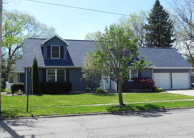 view of front of home with a shingled roof, an attached garage, concrete driveway, and a front lawn