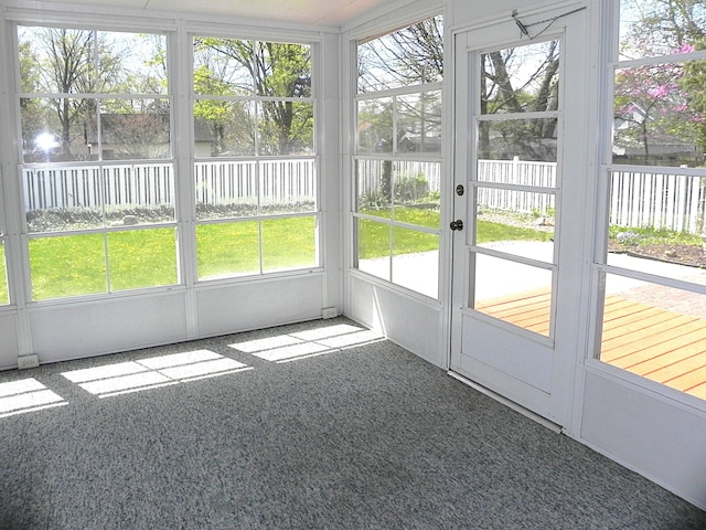 unfurnished sunroom with french doors and a healthy amount of sunlight