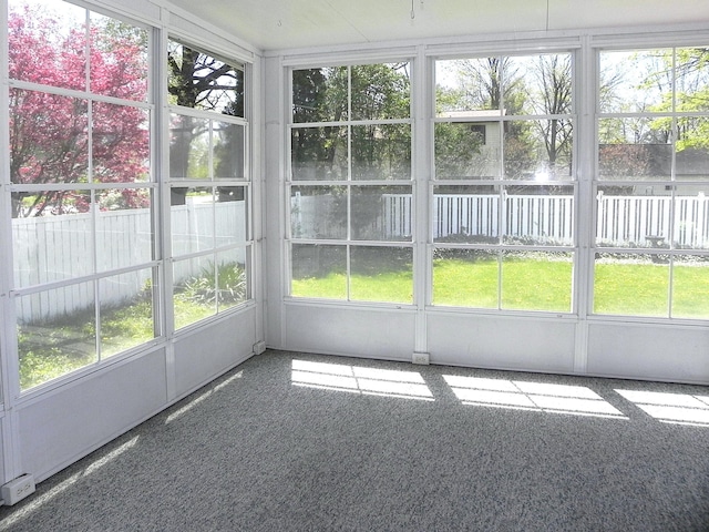 unfurnished sunroom featuring a healthy amount of sunlight