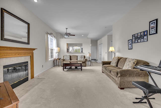 carpeted living room featuring baseboards, recessed lighting, ceiling fan, and a tile fireplace