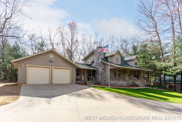 3087 38th St, Hamilton, MI 49419 - view of front of house featuring an attached garage, a front lawn, a chimney, covered porch, and driveway