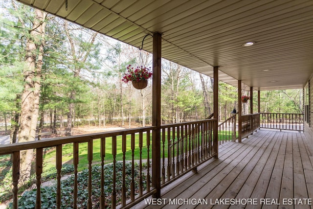 3087 38th St, Hamilton, MI 49419 - deck featuring a porch and a lawn