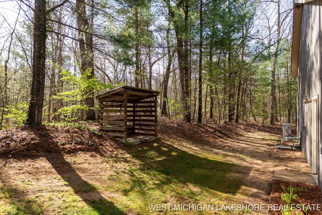 3087 38th St, Hamilton, MI 49419 - view of yard featuring a wooded view