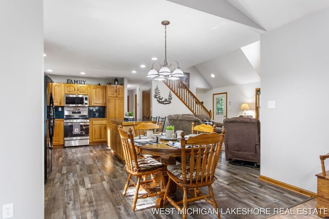 3087 38th St, Hamilton, MI 49419 - dining area with vaulted ceiling, recessed lighting, stairs, and dark wood-type flooring