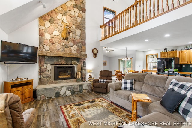 3087 38th St, Hamilton, MI 49419 - living area with a stone fireplace, recessed lighting, high vaulted ceiling, and hardwood / wood-style flooring