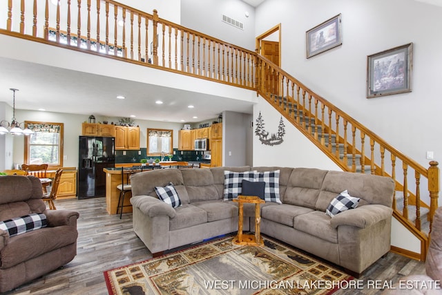 3087 38th St, Hamilton, MI 49419 - living room featuring recessed lighting, visible vents, light wood finished floors, and stairs