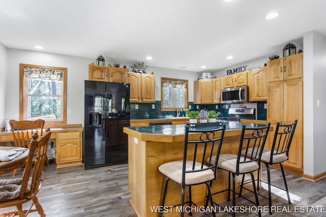 3087 38th St, Hamilton, MI 49419 - kitchen featuring tasteful backsplash, stainless steel appliances, recessed lighting, and light wood-style flooring
