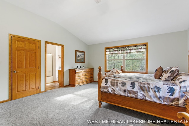 3087 38th St, Hamilton, MI 49419 - carpeted bedroom featuring baseboards, vaulted ceiling, and ensuite bath