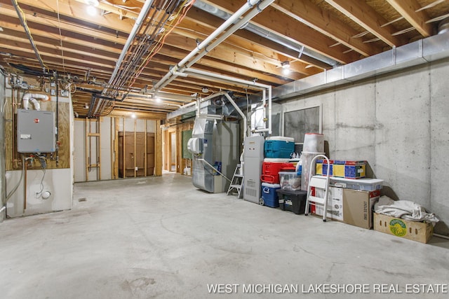 3087 38th St, Hamilton, MI 49419 - unfinished basement featuring tankless water heater and heating unit
