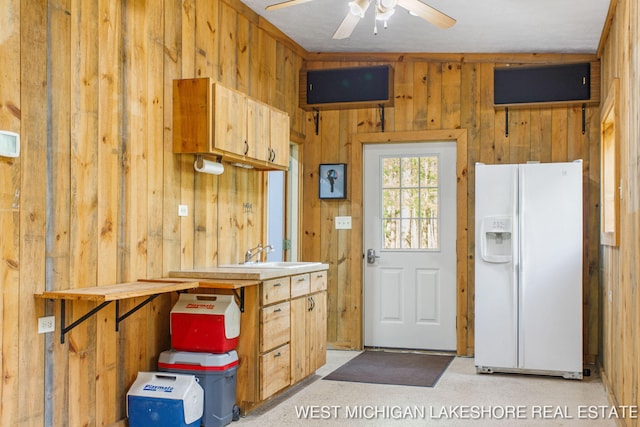 3087 38th St, Hamilton, MI 49419 - interior space featuring a ceiling fan, a sink, and wooden walls