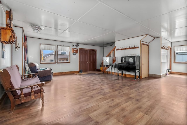 interior space with baseboards and wood finished floors