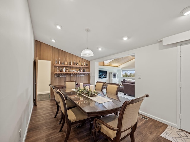 dining room featuring visible vents, dark wood-style flooring, baseboards, recessed lighting, and vaulted ceiling