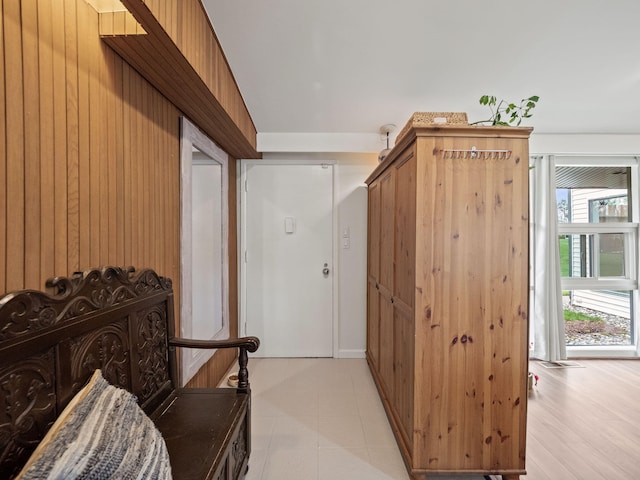 hallway with wood walls