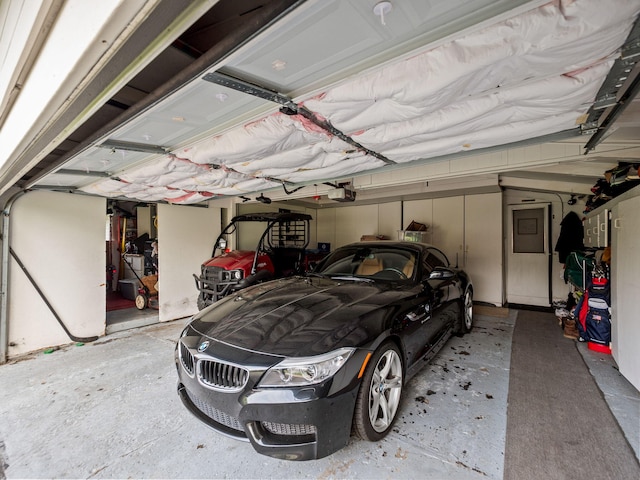 garage featuring a garage door opener