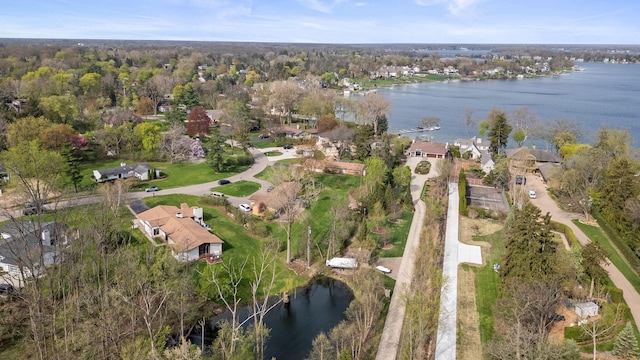 aerial view with a water view and a residential view