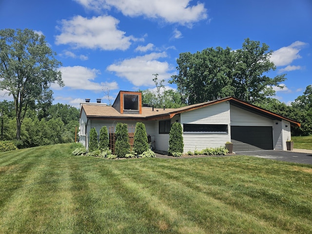 2330 N Pine Center Dr, West Bloomfield, MI 48323 - view of front of home with driveway, a front yard, and an attached garage