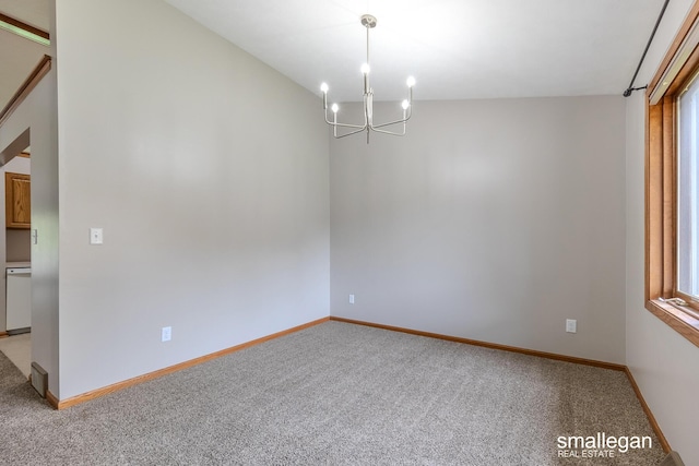 spare room featuring light colored carpet, baseboards, and a notable chandelier