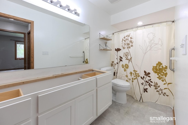 bathroom with toilet, tile patterned floors, a shower with shower curtain, and vanity