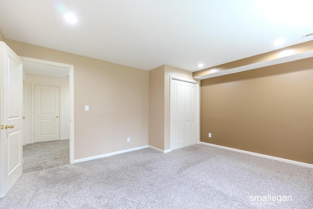 below grade area with recessed lighting, carpet, baseboards, and visible vents