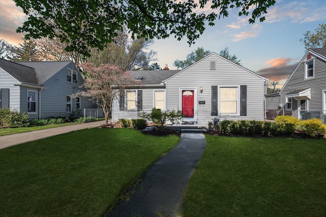 view of front of house with a yard and a chimney