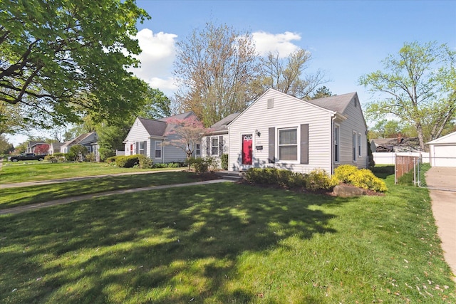 bungalow-style house featuring a front lawn