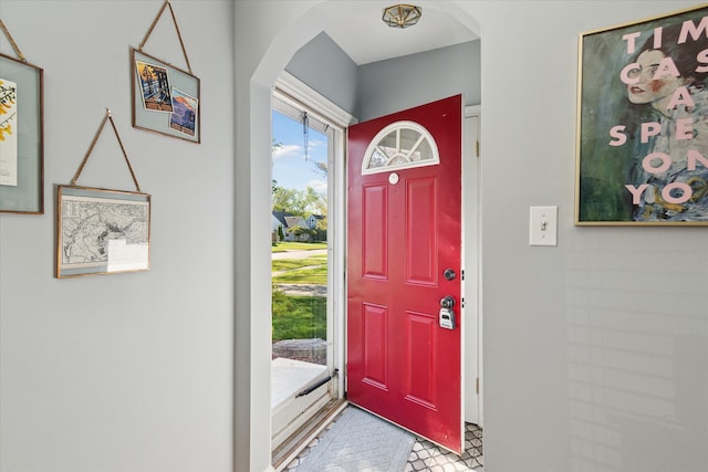 entrance foyer featuring arched walkways