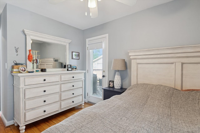 bedroom with ceiling fan, dark wood-style floors, access to exterior, and baseboards