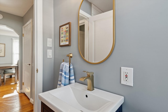 bathroom with vanity and hardwood / wood-style floors