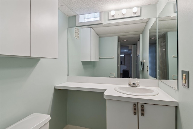 half bathroom featuring toilet and vanity