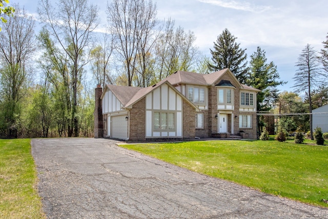 1683 Mark Hopkins Rd, Bloomfield Hills, MI 48302 - view of front facade with brick siding, driveway, a garage, a front lawn, and board and batten siding
