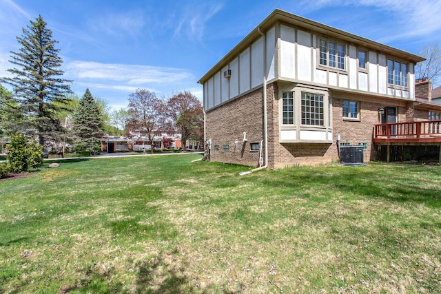 1683 Mark Hopkins Rd, Bloomfield Hills, MI 48302 - rear view of house with brick siding, cooling unit, a yard, and board and batten siding