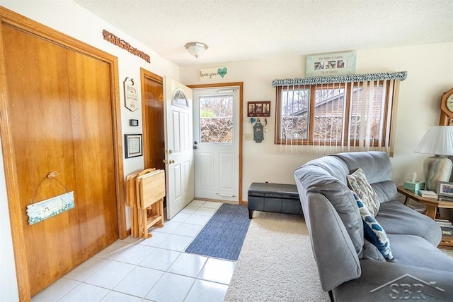 4438 N Verity Rd, Sanford, MI 48657 - interior space featuring a textured ceiling and light tile patterned floors