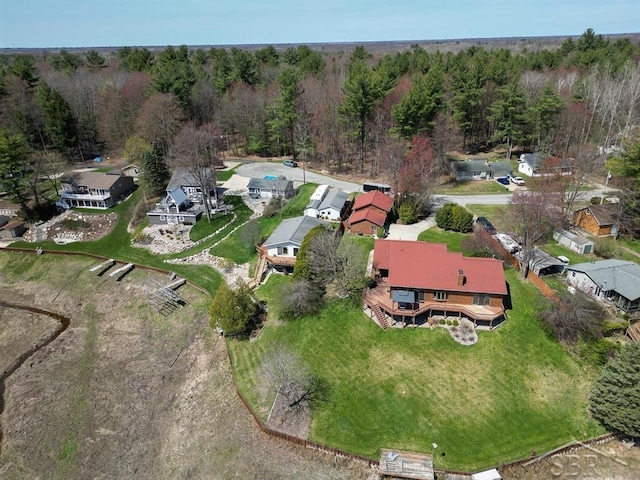 4438 N Verity Rd, Sanford, MI 48657 - drone / aerial view with a residential view and a wooded view