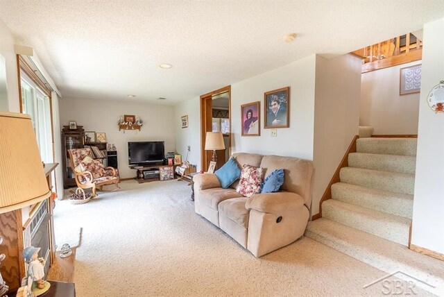 4438 N Verity Rd, Sanford, MI 48657 - living room featuring carpet floors and stairs