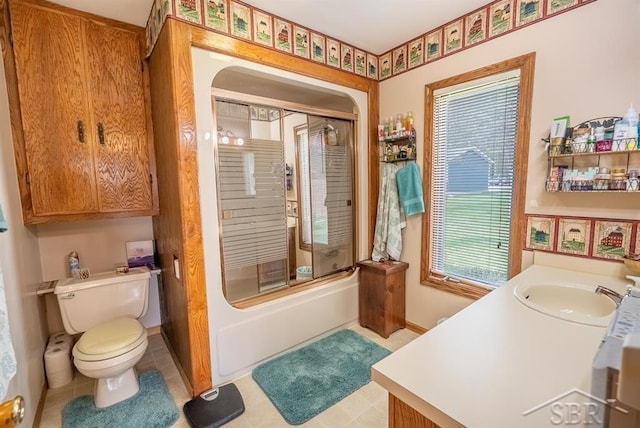 4438 N Verity Rd, Sanford, MI 48657 - bathroom with vanity, baseboards, combined bath / shower with glass door, and toilet