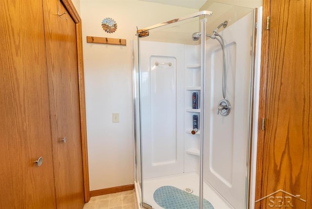 4438 N Verity Rd, Sanford, MI 48657 - bathroom with baseboards and a stall shower