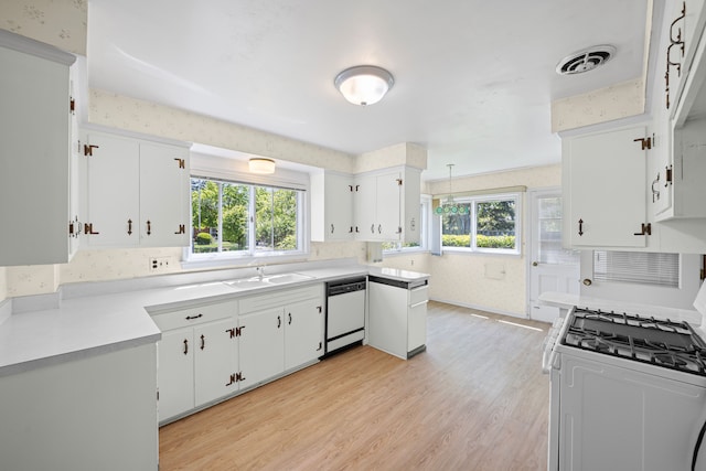 605 S Higbie Pl, Grosse Pointe Woods, MI 48236 - kitchen featuring white appliances, a sink, plenty of natural light, and light countertops