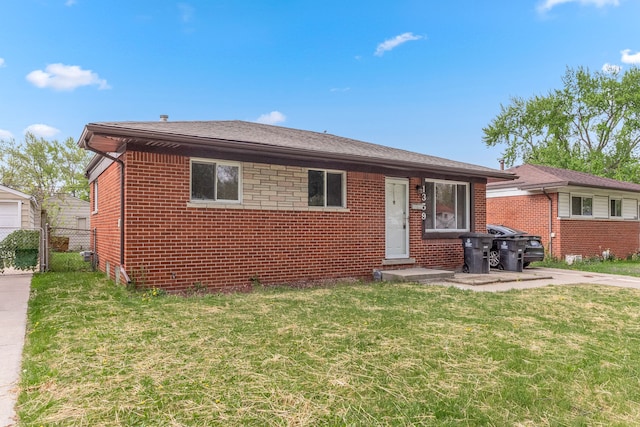 single story home with brick siding, fence, and a front lawn