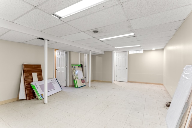 finished below grade area with a paneled ceiling