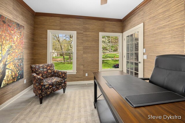 home office with crown molding, baseboards, visible vents, and ceiling fan