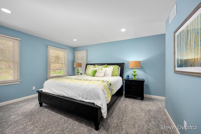 carpeted bedroom with baseboards, recessed lighting, and visible vents
