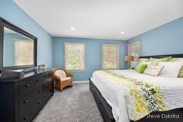bedroom featuring recessed lighting, baseboards, multiple windows, and carpet