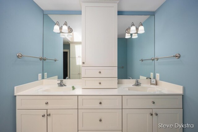 bathroom featuring double vanity and a sink