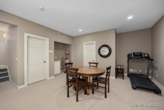 dining space featuring baseboards, light colored carpet, recessed lighting, and visible vents
