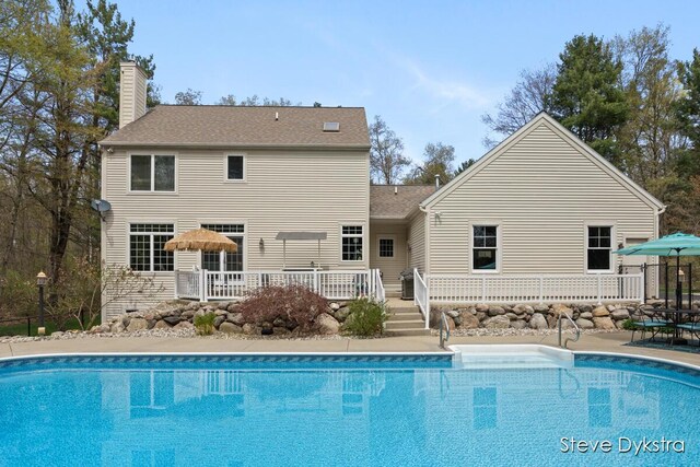 outdoor pool with a deck