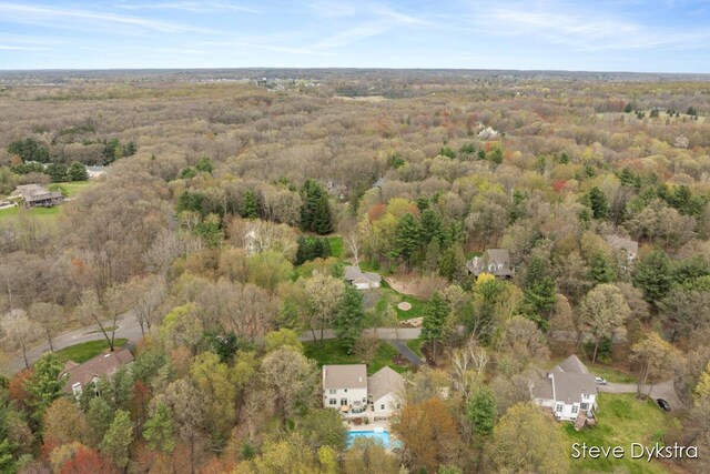 aerial view featuring a view of trees